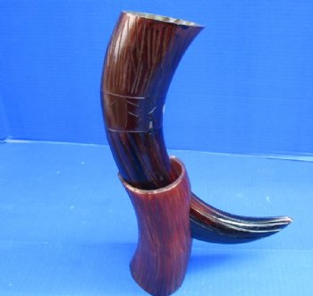 14 to 18 inches Dyed Reddish Brown Cow Horns Carved, Engraved with Lines and Letters. Each comes with a horn stand.   <font color=red> Wholesale</font> - 8 @ $15.95 each <font color=red> CLOSEOUT 10 @ $9.00 EACH</FONT>