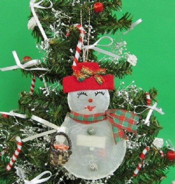 4 inches  Capiz Shell Snowman Ornaments with basket of flowers - 10 @ $2.56 each; 